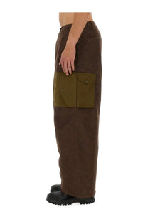 Ten c men’s cargo pants awake ny ten green in brown suede with olive green patch pockets visible from the front
