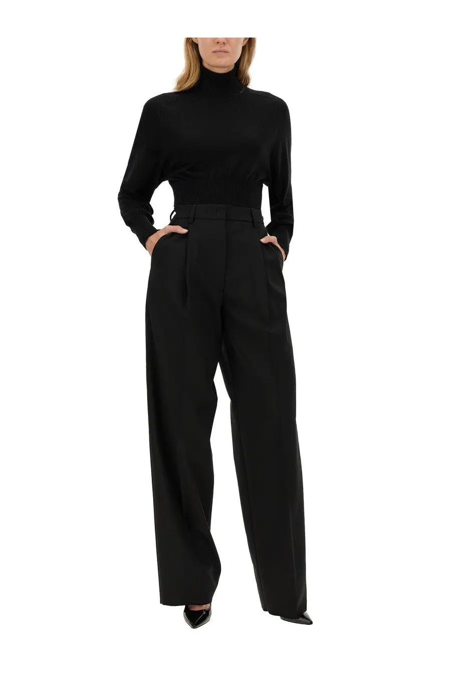 Thelatest women’s axel pants black paired with a sleek black high neck long sleeve fitted top