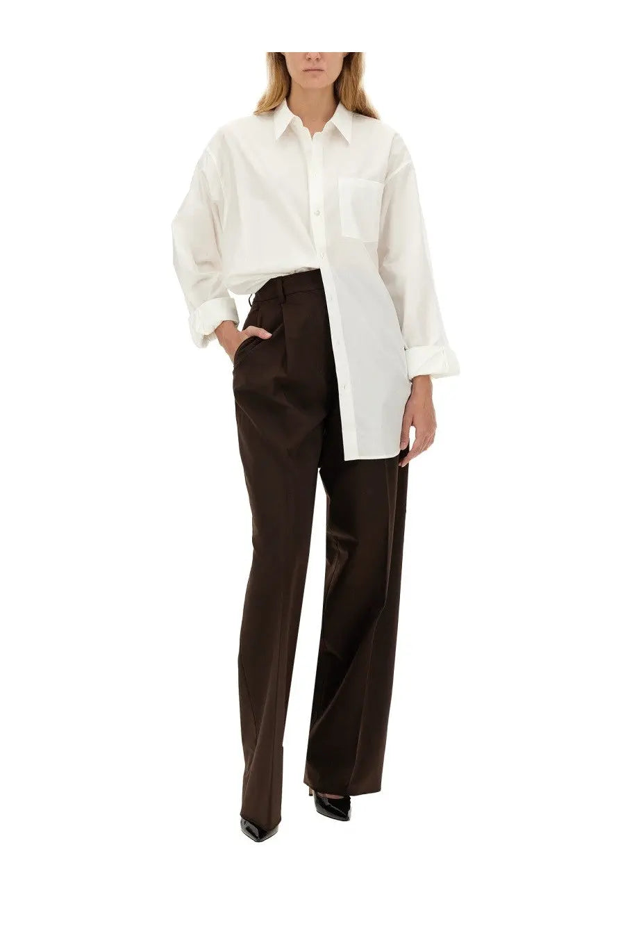 Thelatest women’s brown axel pants paired with a white oversized button-down shirt with rolled cuffs and chest pocket