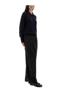 Thelatest women’s navy blue long-sleeved polo shirt with classic collar and ribbed cuffs for casual wear