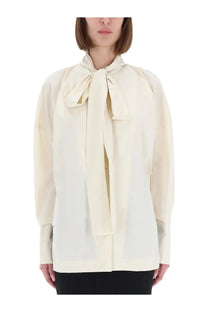 Thelatest women’s shirt cecilia yellow cream-colored silk blouse with a prominent bow at the neckline