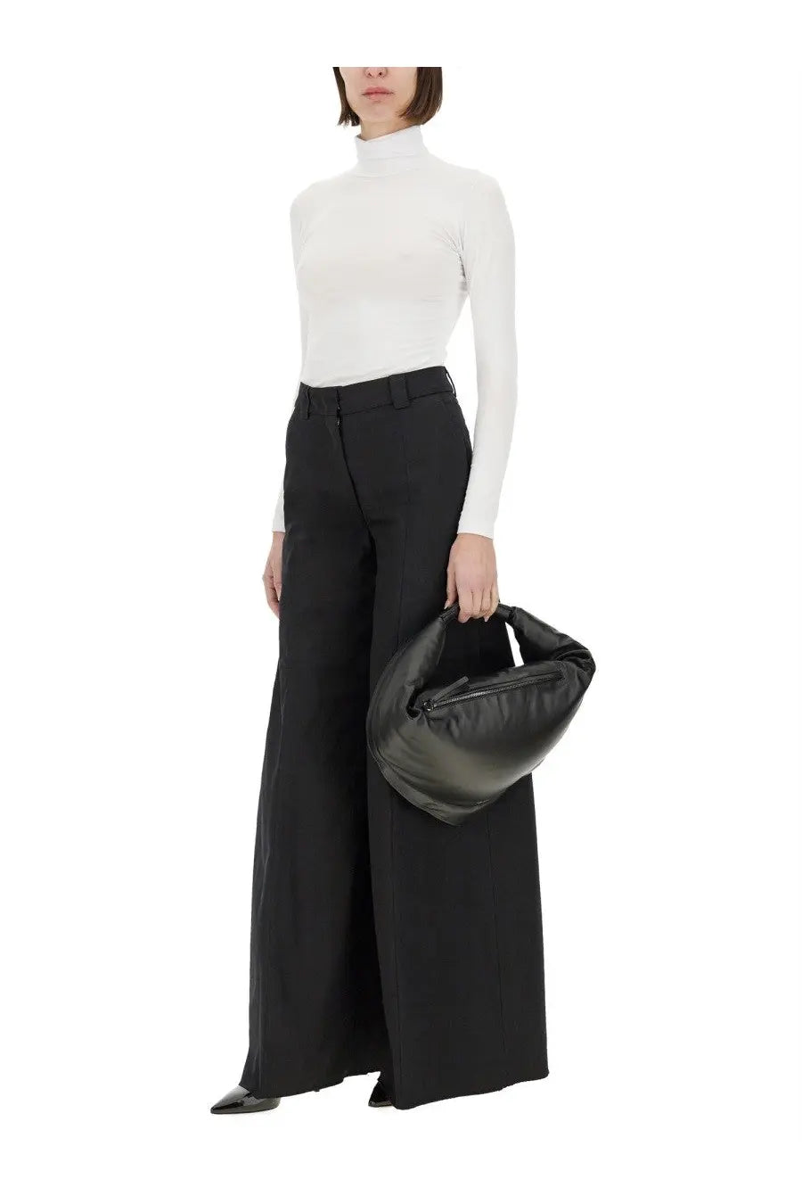 A black leather bottega veneta handbag with soft sculpted shape and top handle for thelatest women’s wide pant alma black