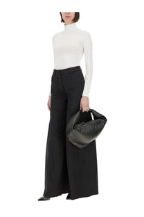 A black leather bottega veneta handbag with soft sculpted shape and top handle for thelatest women’s wide pant alma black