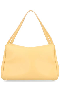 A soft yellow leather shoulder bag with slender handles and minimalist design from Themoirè Women’s Bag Eudora Beige
