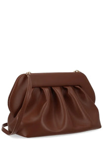 A sleek caramel-brown leather clutch with soft pleated design and gold-tone hardware from Themoirè women’s borsa bios brown