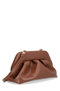Themoirè women’s medium bios bag brown is a soft draped brown leather clutch with gold tone hardware