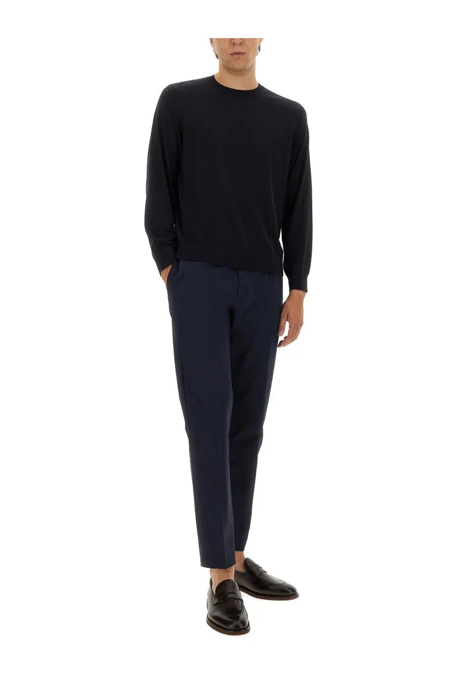 Theory men’s wool jersey blue sleek black long-sleeved knit sweater with round neckline paired with navy trousers