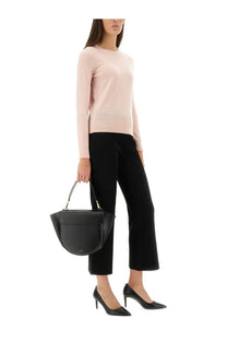 Black leather handbag with sleek curved design and gold-tone hardware complementing theory women’s flare pant black