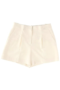 Theory women’s cream-colored tailored shorts with structured waistband and pleated front in fluid white fabric