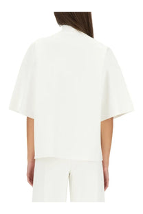 White cropped blouse with wide soft cape-like sleeves and high collar from Theory women’s turtleneck top white collection