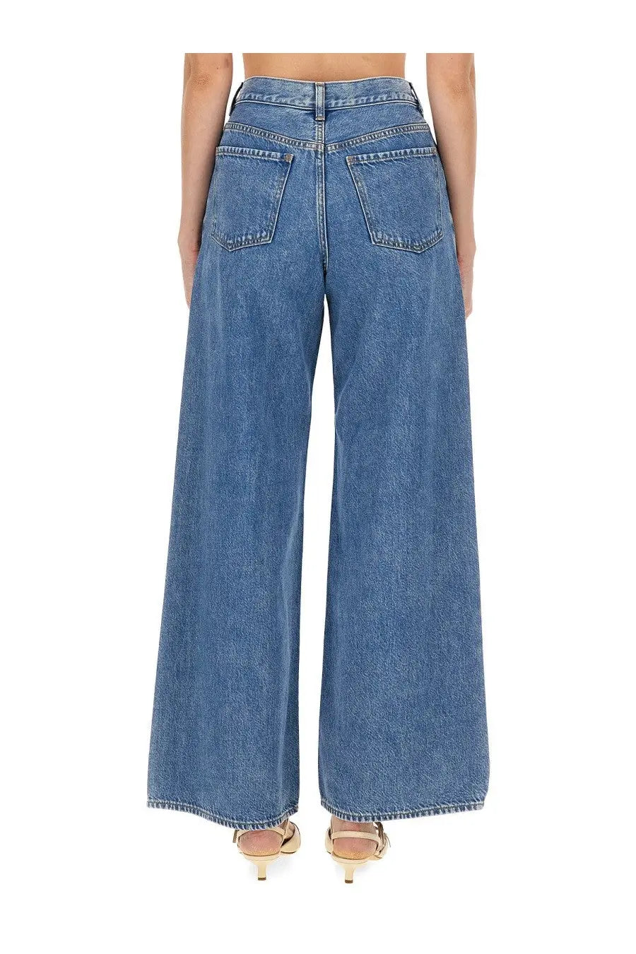 Theory women’s blue denim wide leg jeans with high waist and classic back pockets shown from the back side
