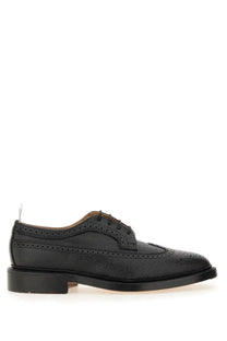 Thom Browne men’s brogue classic longwing black leather oxford shoe with textured surface and perforated detailing