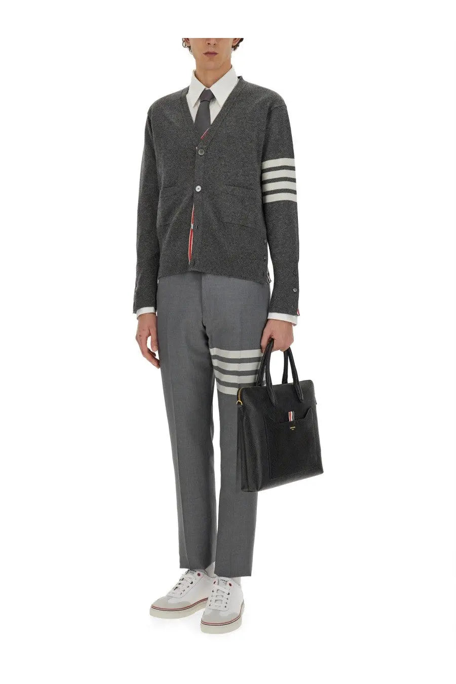 Black leather briefcase with gold-tone hardware and small logo plaque featured with thom browne men’s white button down shirt