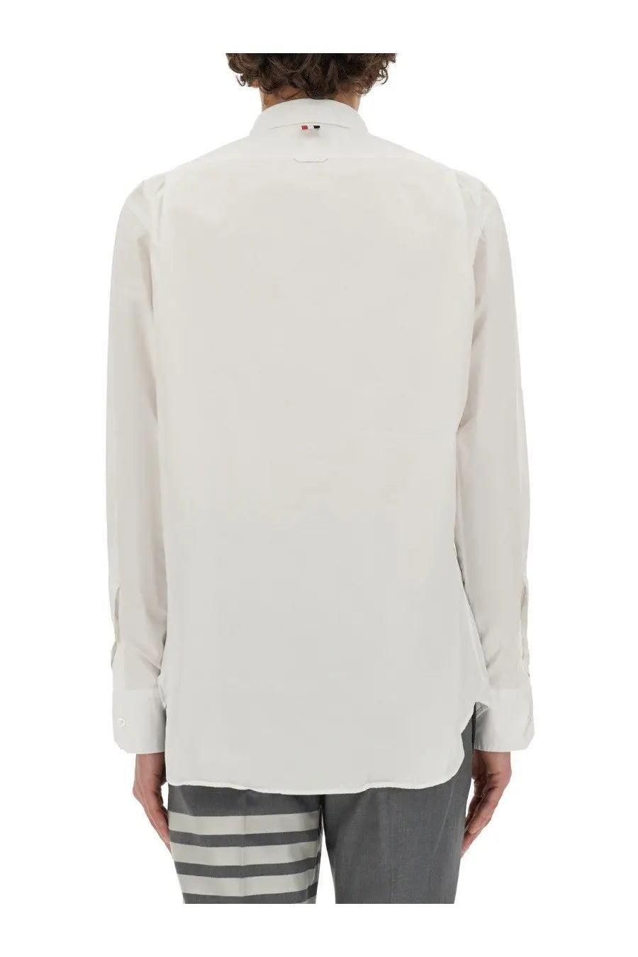 Thom Browne men’s crisp white long-sleeved button-up shirt with classic collar and subtle stitching details
