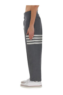 Thom Browne men’s classic grey trousers with three bold white horizontal stripes on lower leg in smooth structured fabric