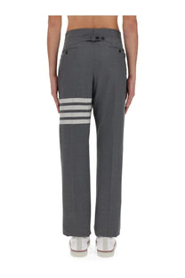 Thom Browne men’s classic gray trousers with three white stripes on lower leg in structured tailored fabric