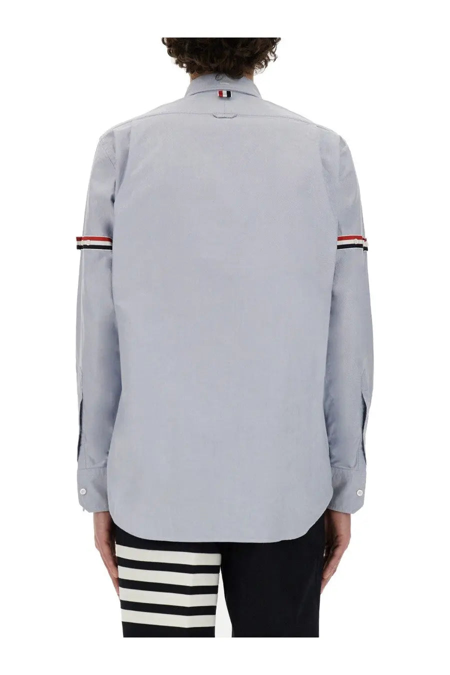 Thom Browne men’s classic light gray long-sleeve button-up shirt with red white and black striped cuffs