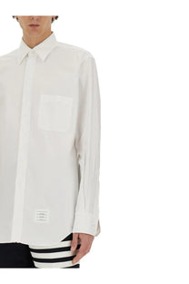 Thom Browne men’s white cotton long-sleeved button-down shirt with chest pocket and small hem label