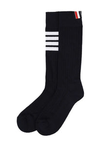Thom browne men’s cotton socks in black with three white stripes and red white blue tab at the top