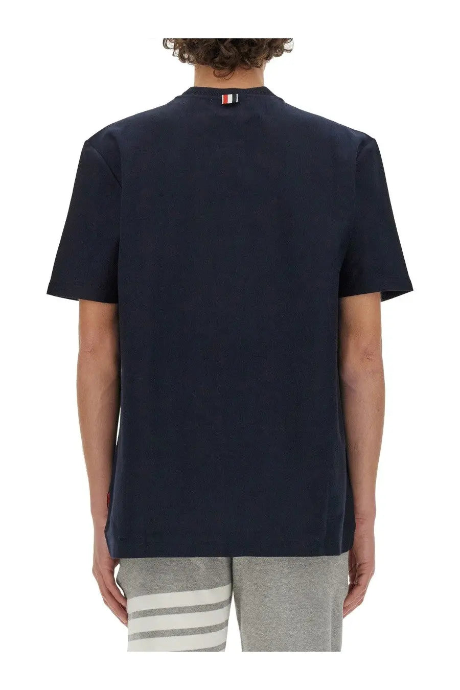 Navy blue cotton thom browne men’s jersey shirt with small striped logo at the neckline
