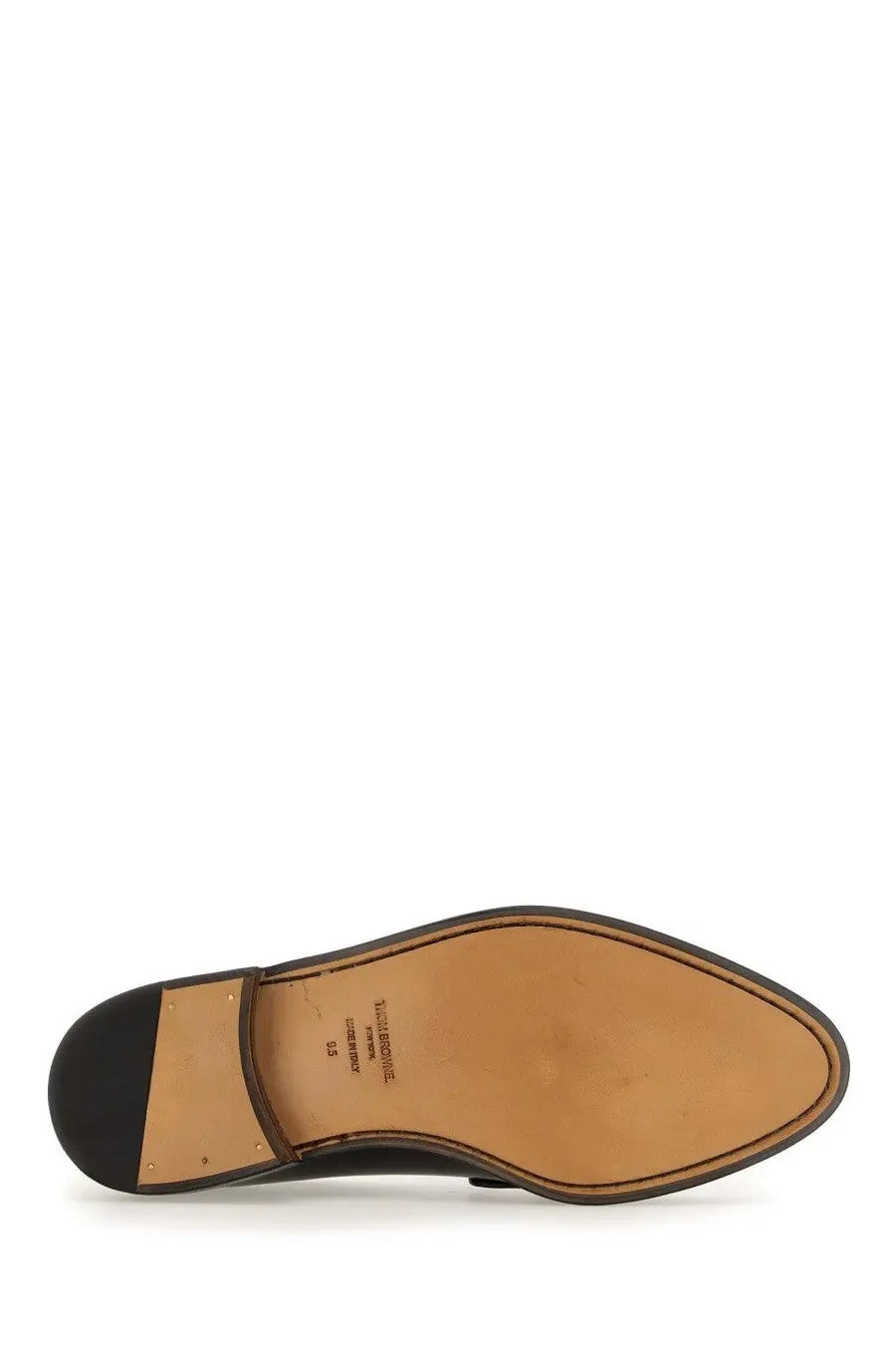 Thom Browne men’s black leather loafer with tan rubber sole and stitched detailing designed for formal wear