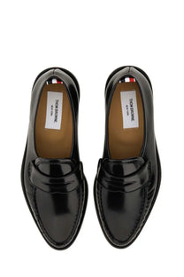 Thom Browne men’s leather loafer black featuring black patent leather with polished finish and classic slip-on design