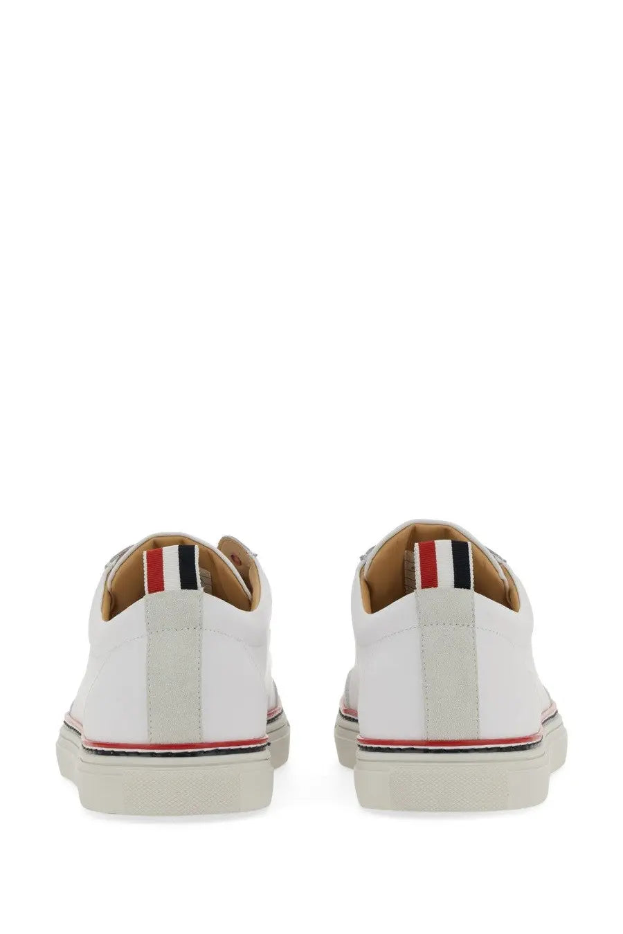 Thom Browne men’s low top white leather sneakers with classic design and red white black striped heel tab back view