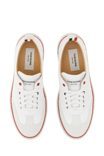 Thom Browne men’s low top leather sneakers white with red stitching and black eyelets