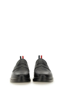 Thom browne men’s moccasin penny black black leather loafers with classic broguing and striped pull tabs at the heel