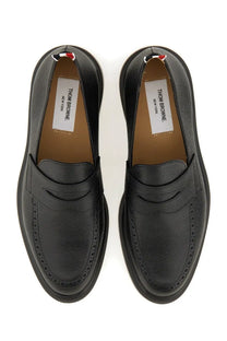 Thom Browne men’s black leather loafers with textured surface and classic brogue detailing