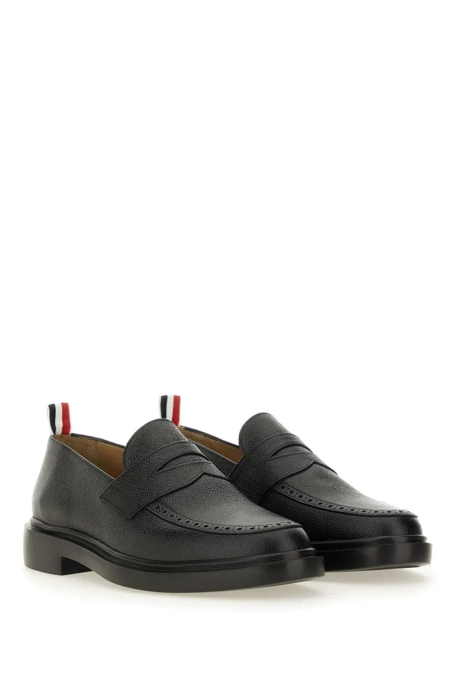 Black leather loafers with textured finish and classic brogue detailing featuring thom browne red white blue heel tab