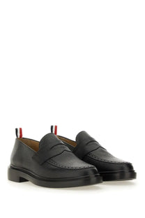 Black leather loafers with textured finish and classic brogue detailing featuring thom browne red white blue heel tab