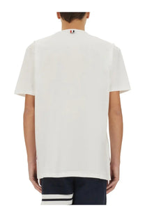 Thom Browne men’s white cotton t-shirt with a small red white and blue logo at the neckline