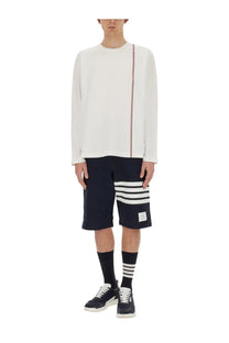Thom Browne men’s white long-sleeved shirt with red white and blue vertical stripe detail on the side