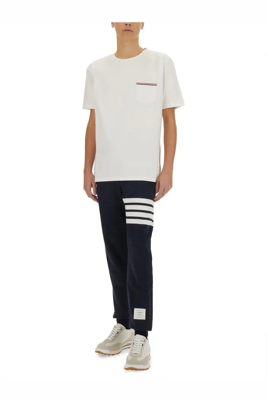 Thom Browne men’s white t-shirt with chest pocket featuring the brand signature red white and blue striped detail