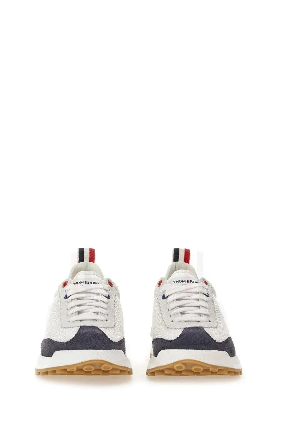 Thom Browne men’s sneaker tech runner blue with white navy upper gum rubber sole and red white black heel tab back view