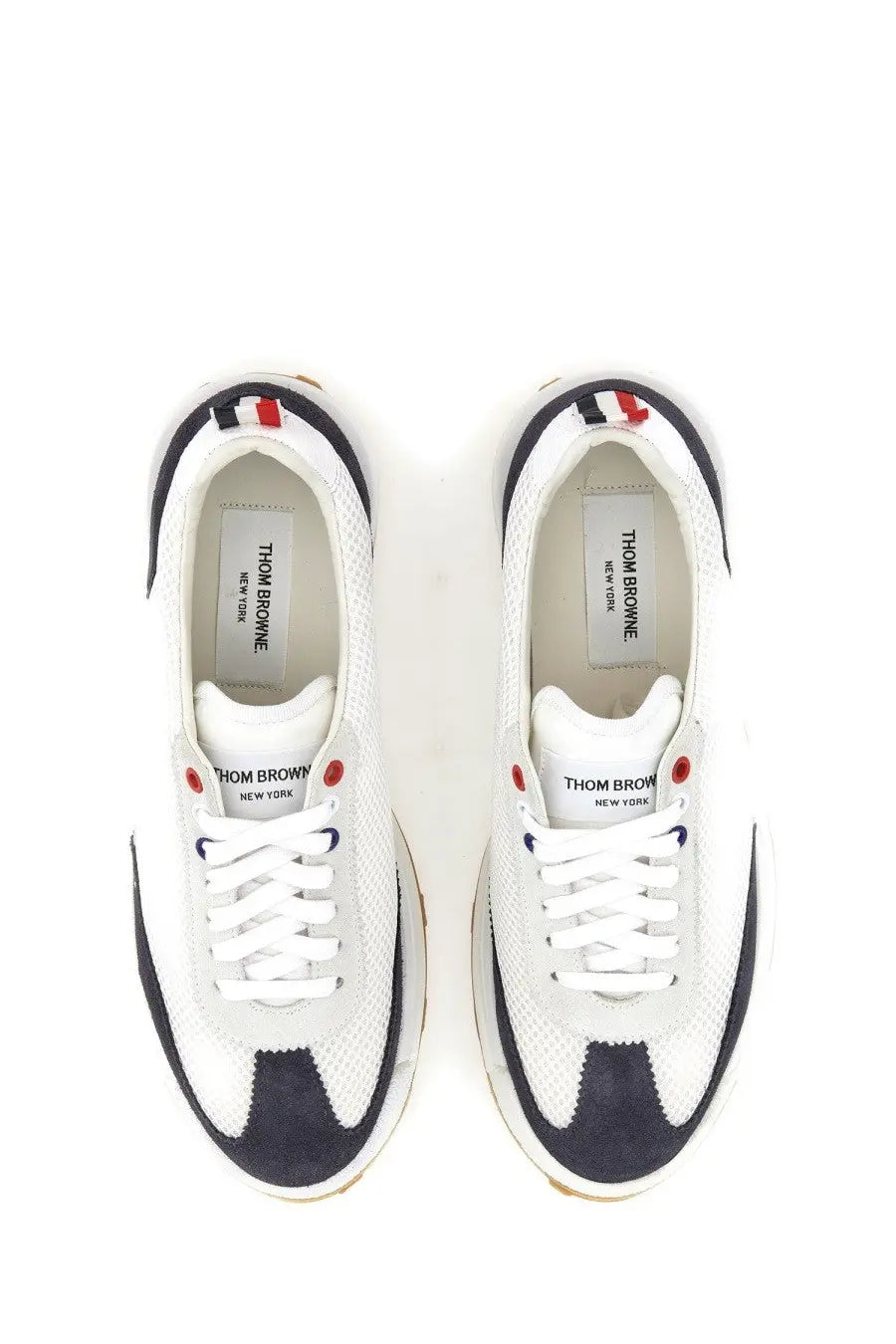 Thom Browne men’s sneaker tech runner blue in white and navy with red eyelets and textured mesh upper
