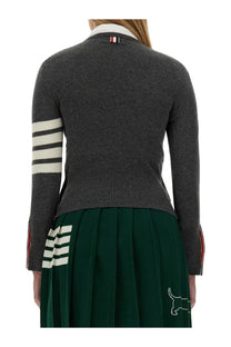Thom Browne women’s grey cashmere sweater with three white sleeve stripes and red white blue logo at neckline