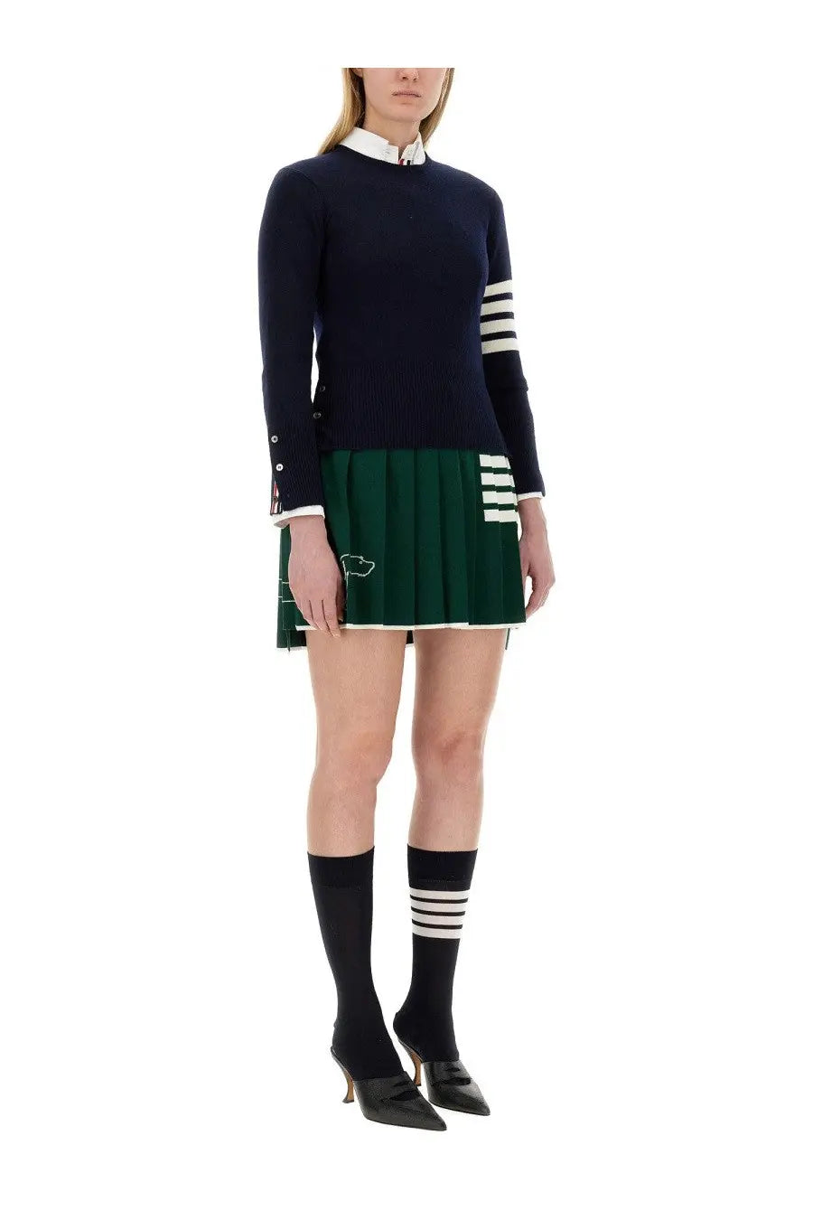 Thom browne women’s shirt blue paired with navy blue and green pleated skirt with white side stripes and matching navy sweater