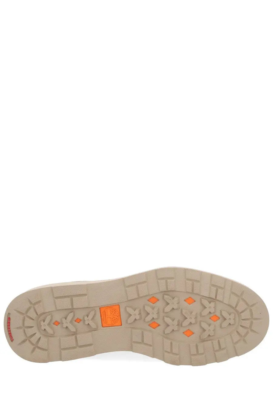 Beige rubber sole with orange diamond and cross patterns on timberland men’s waterproof chukka boot brown