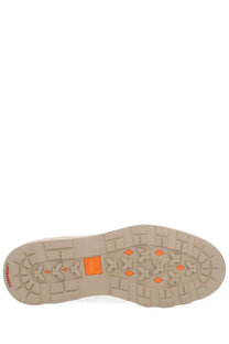 Beige rubber sole with orange diamond and cross patterns on timberland men’s waterproof chukka boot brown