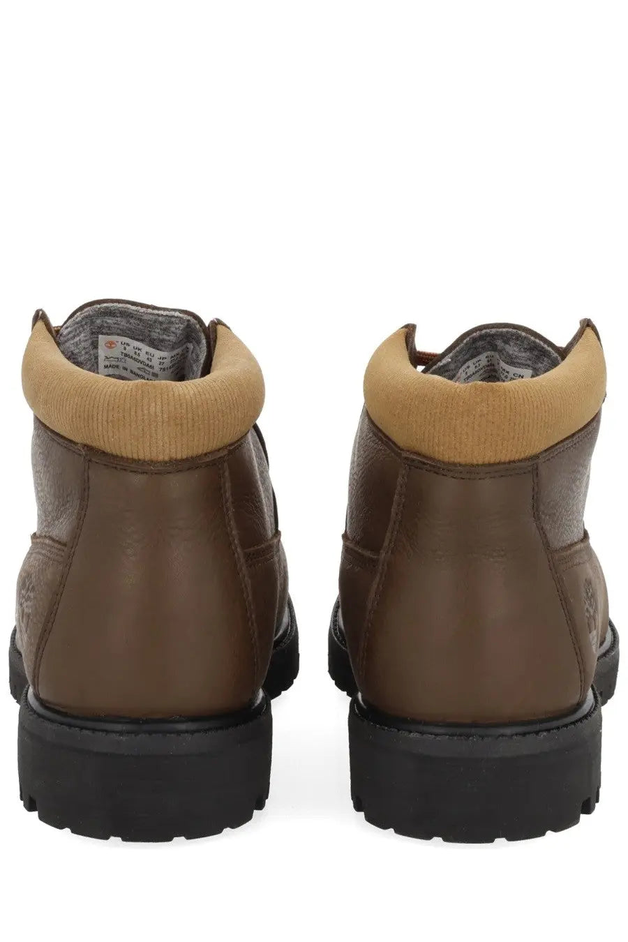 Timberland men’s waterproof brown leather chukka boot with tan ribbed collar and black rubber soles