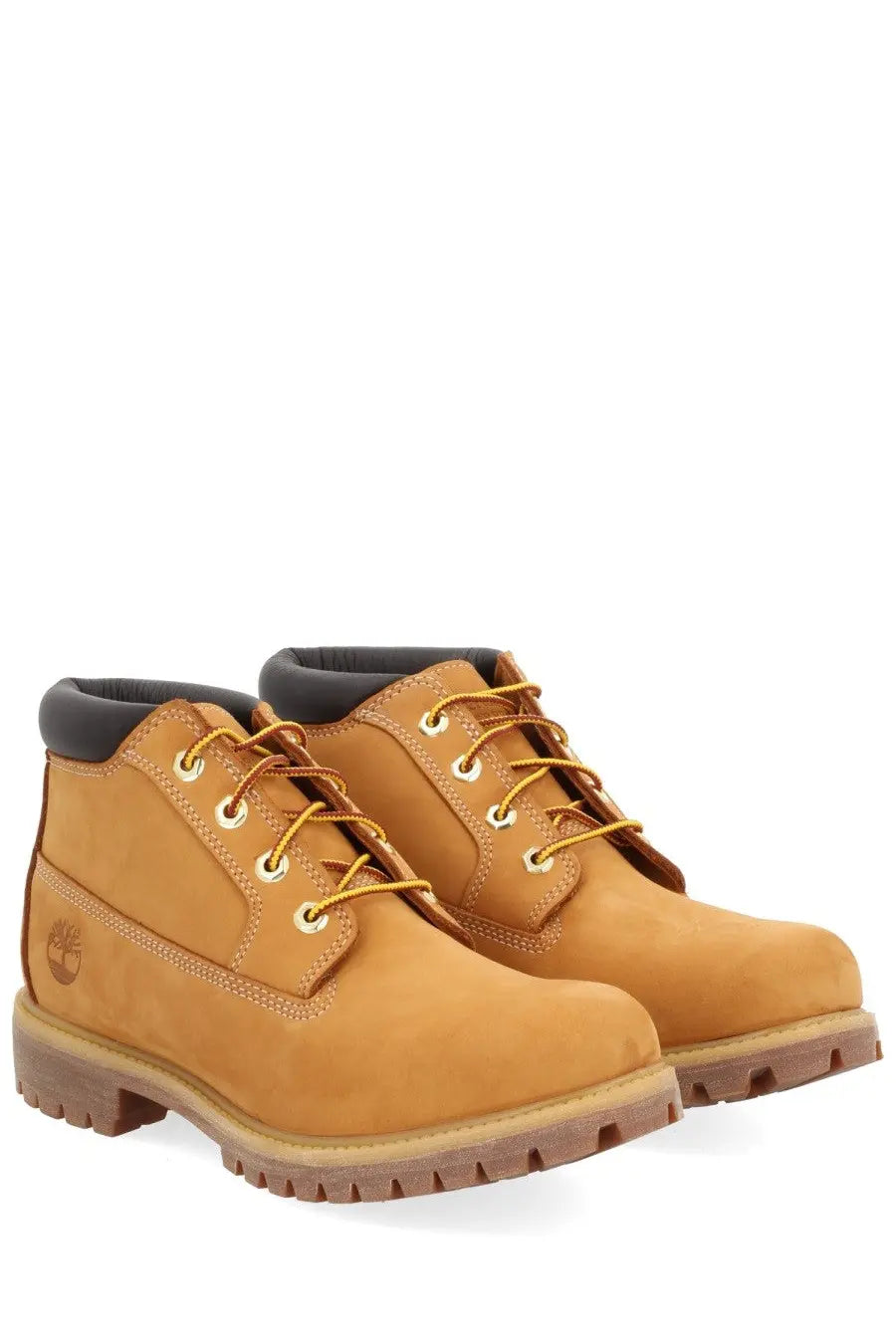 Timberland men’s waterproof chukka boot in tan timberland 6-inch leather with yellow laces and rugged rubber sole