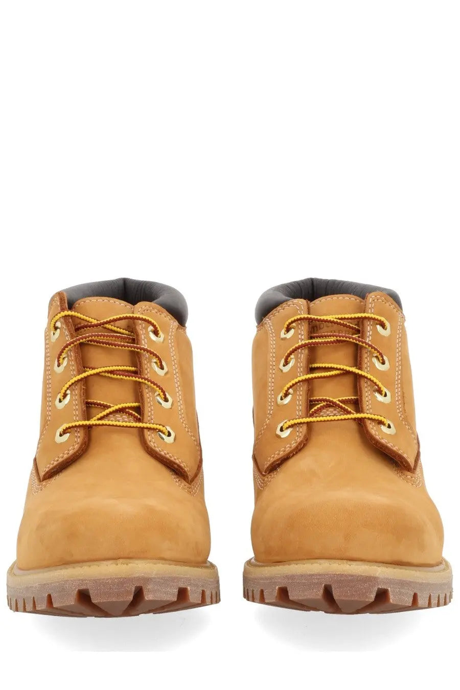 Timberland men’s waterproof chukka boot in tan leather with yellow laces and rugged rubber sole for durability
