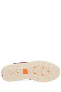Back of timberland men’s waterproof brown leather lace up boot showing cream rubber sole with orange accents