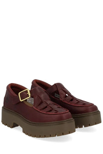 Timberland women’s loafer in burgundy leather with platform sole woven strap detail and gold-tone buckle