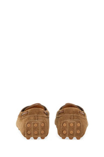 Tod’s men’s leather loafer brown in tan suede with classic moccasin design and circular tread sole pattern