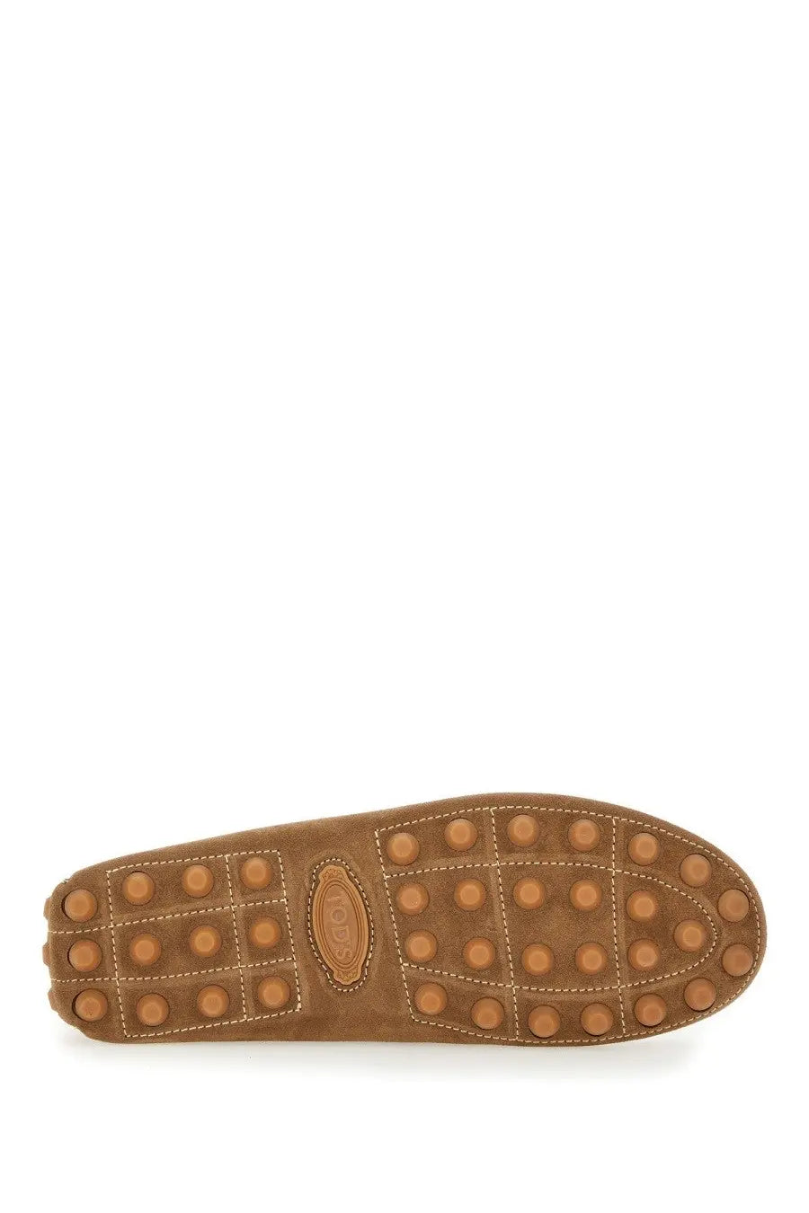 Tan suede sole of tods men’s leather loafer brown featuring circular rubber studs and stitched seams