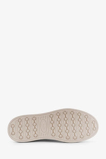 Beige rubber sole with circular tread and embossed Tod’s logo on Tod’s men’s white leather sneakers