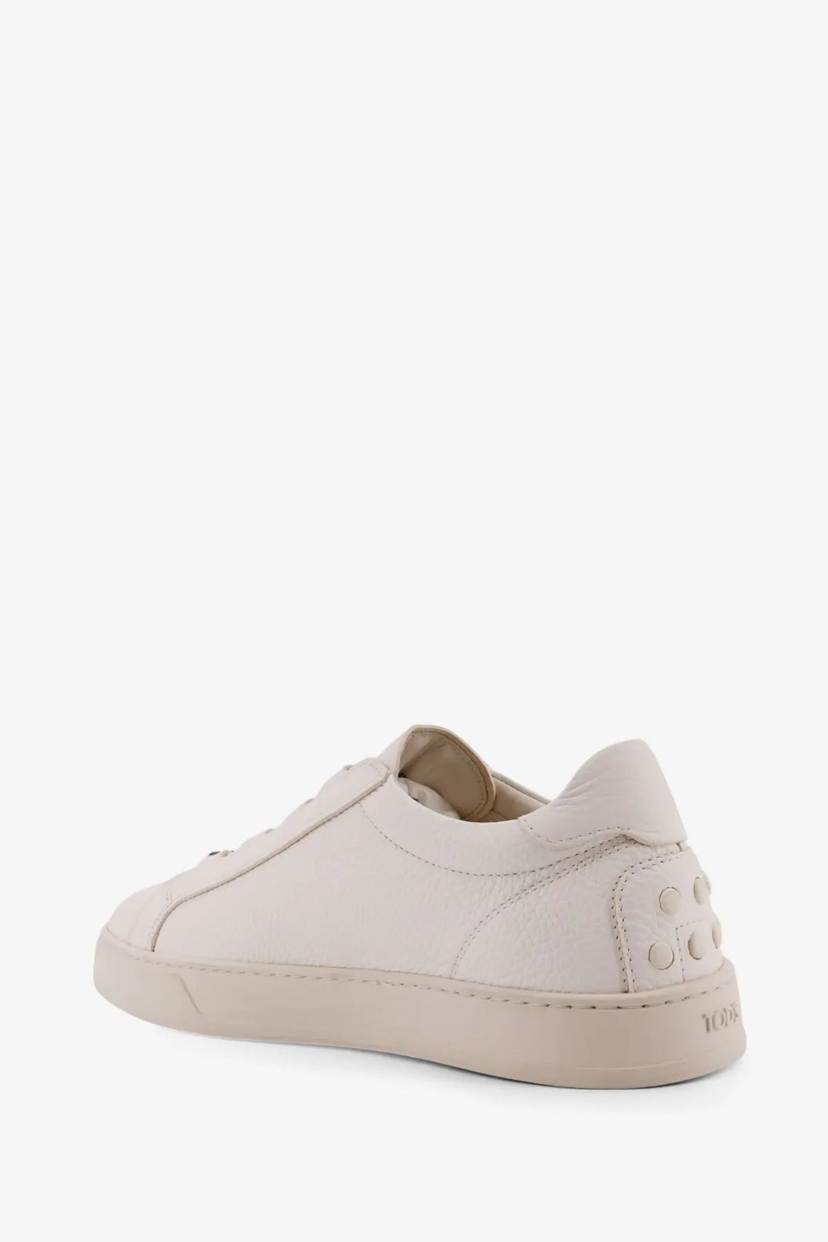 Tod’s men’s leather sneakers white featuring cream-colored leather with minimalist design and subtle stitching details